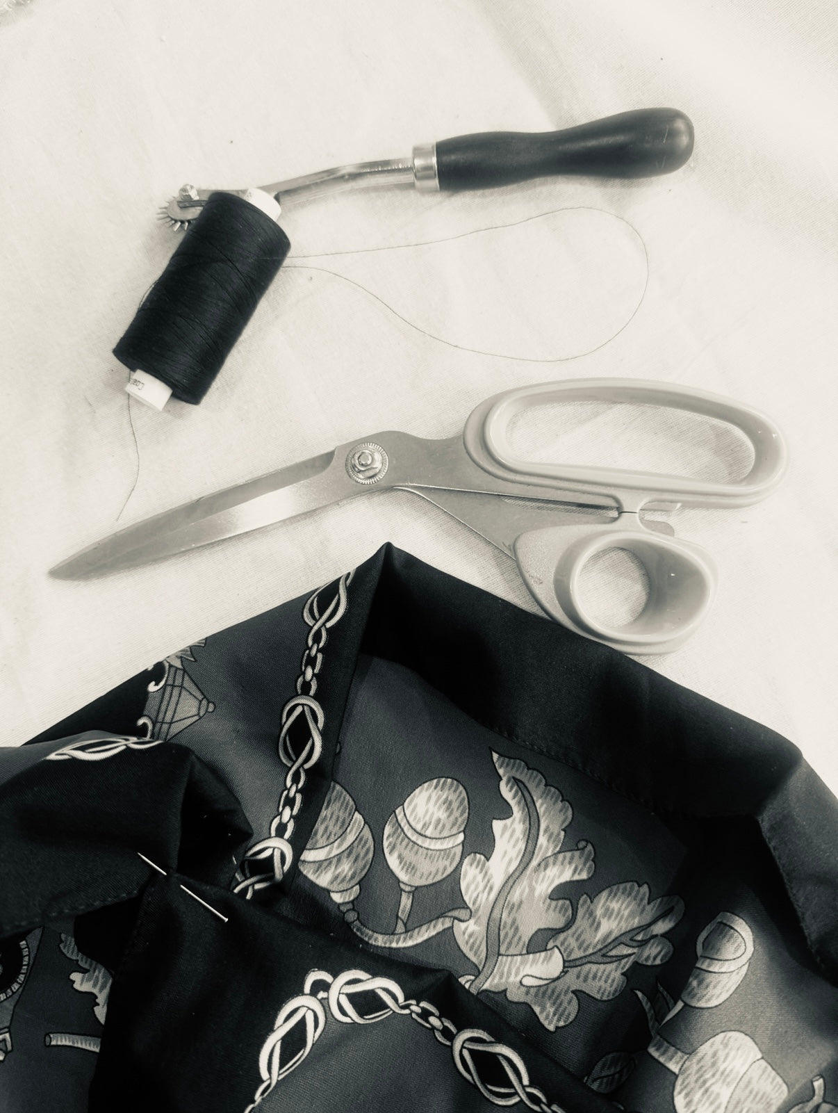 Black silk scarf and tailoring tools in the Yan Neo London studio for Edition 1